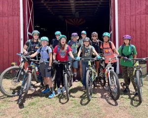Project Rim Country lady shredders pose with massive grins before setting off onto the AZT near Pine